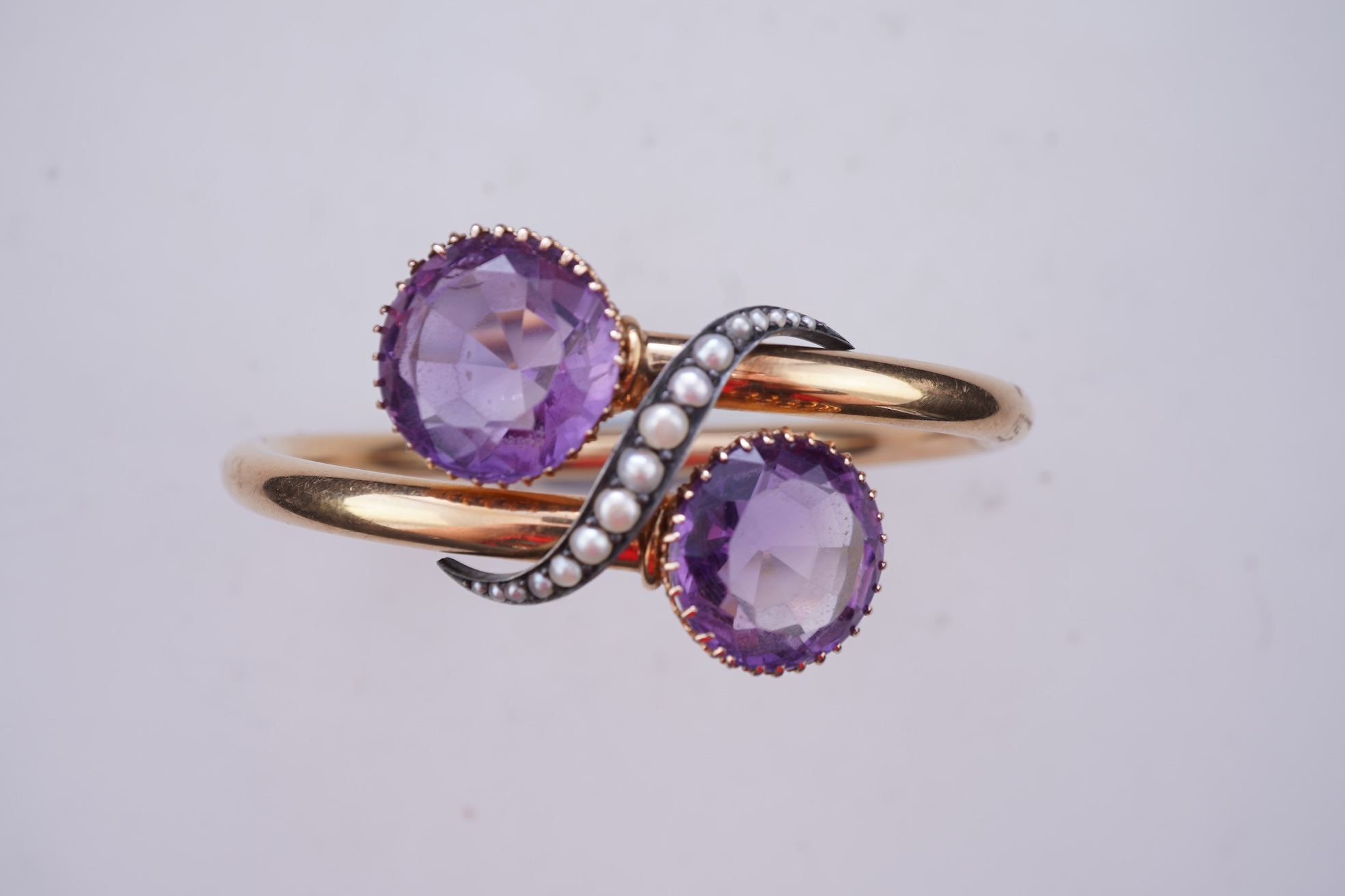 A Victorian gold, pearl and amethyst bangle, late 19th century